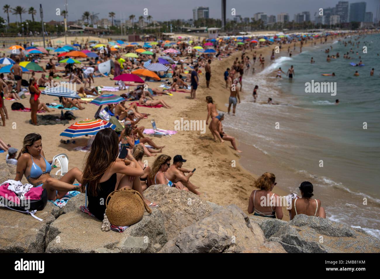 People cool off in the water during warm weather on a beach in Barcelona,  Spain, Sunday, June 19, 2022. Temperatures in Western Europe rose above 40  Cs (104 F) in France and, image size:1300x956