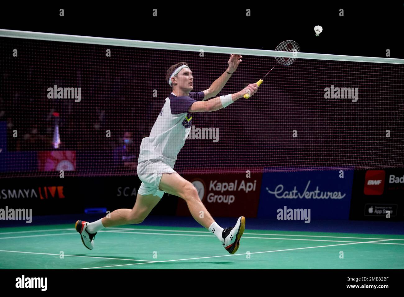 Denmarks Viktor Axelsen plays a shot against Chinas Zhao Jun Peng during their mens singles final match at Indonesia Open badminton tournament at Istora Gelora Bung Karno Stadium in Jakarta, Indonesia, Sunday,