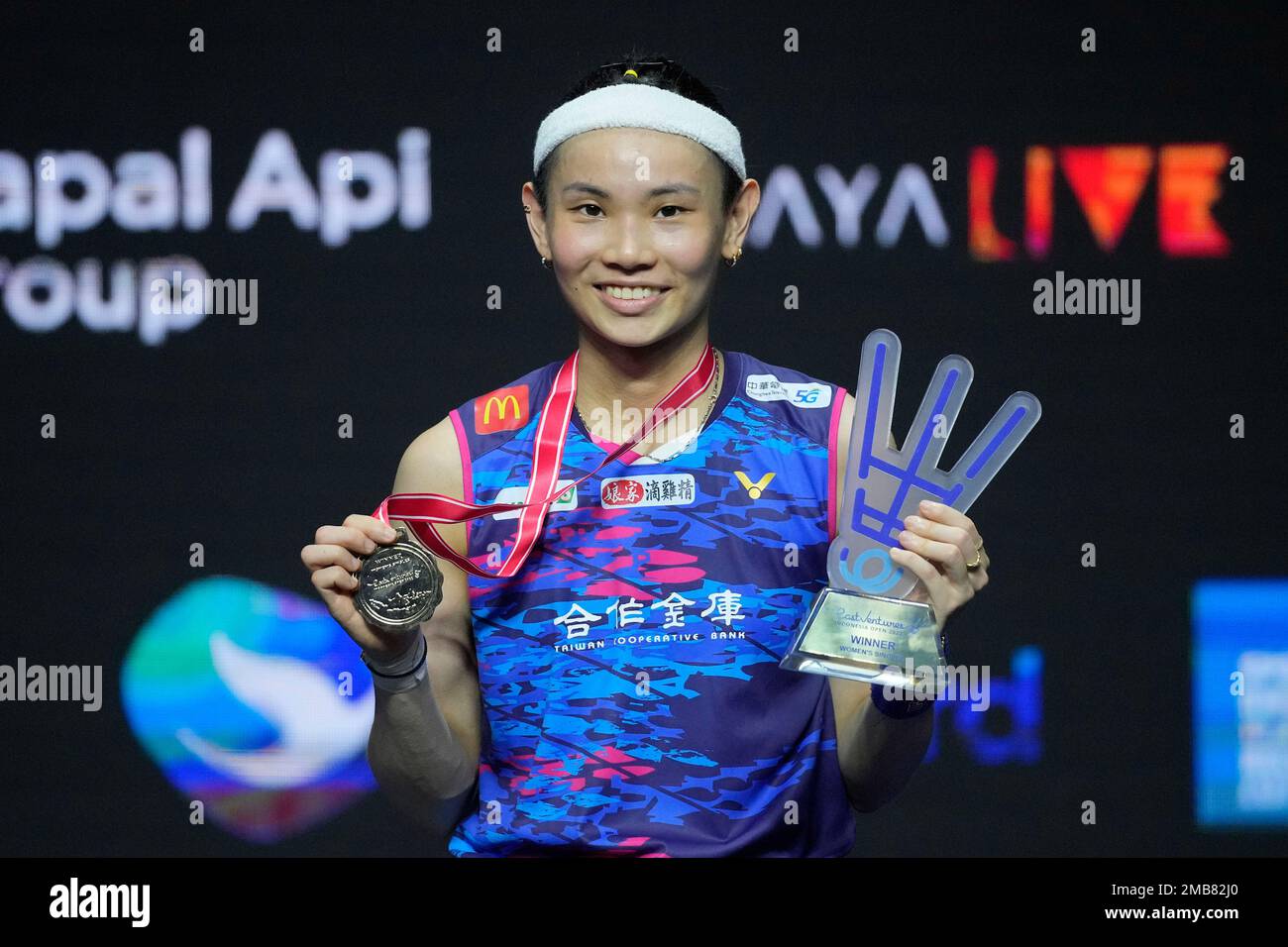 Tai Tzu Ying of Taiwan celebrates on the podium after defeating Chinas Wang Zhi Yi in their womens singles final match at Indonesia Open badminton tournament at Istora Gelora Bung Karno Stadium