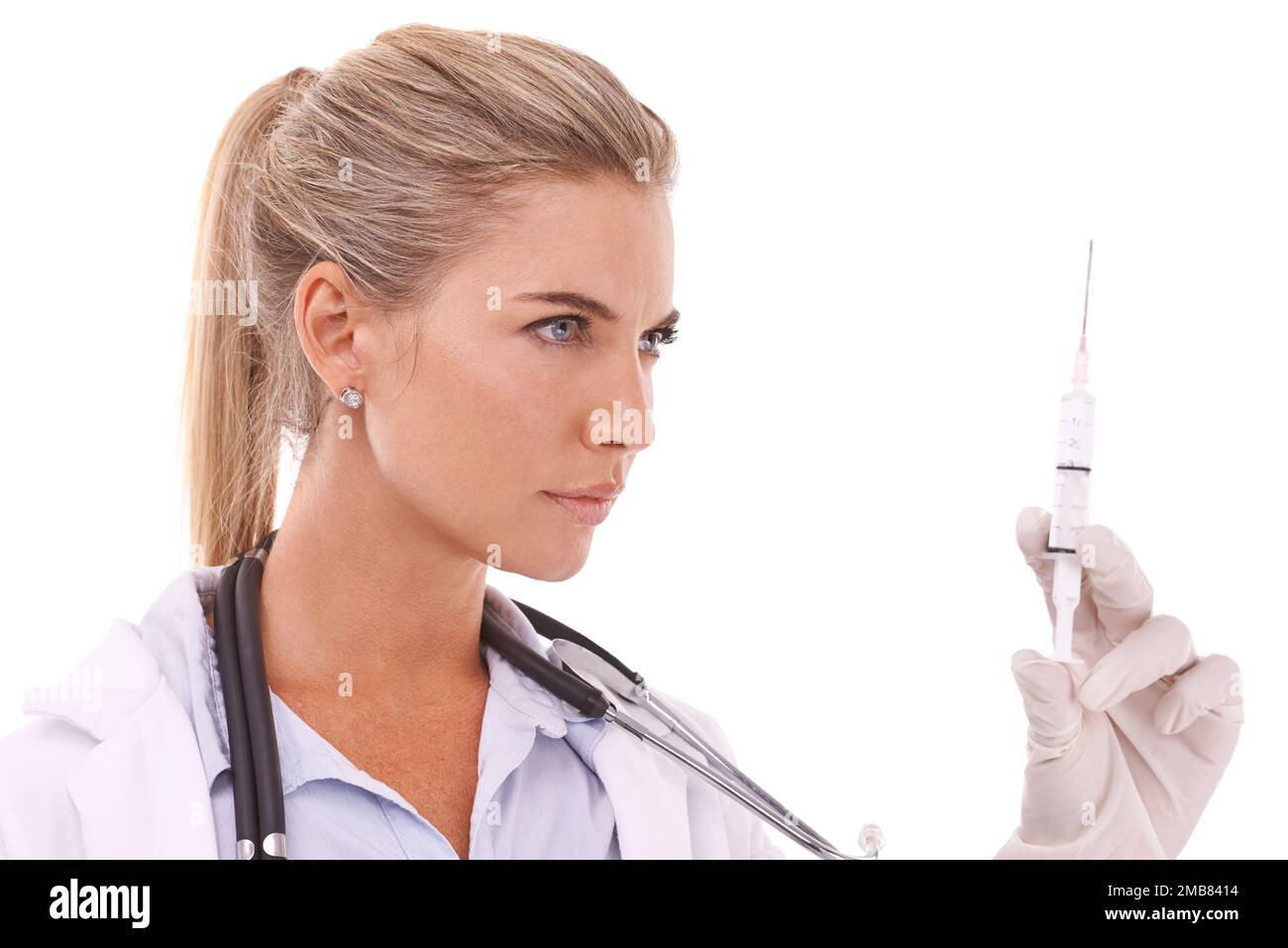Doctor, serious face and syringe thinking for healthcare wellness, vitamins or medical drugs in white background. Nurse, pharmaceutical medicine and Stock Photo