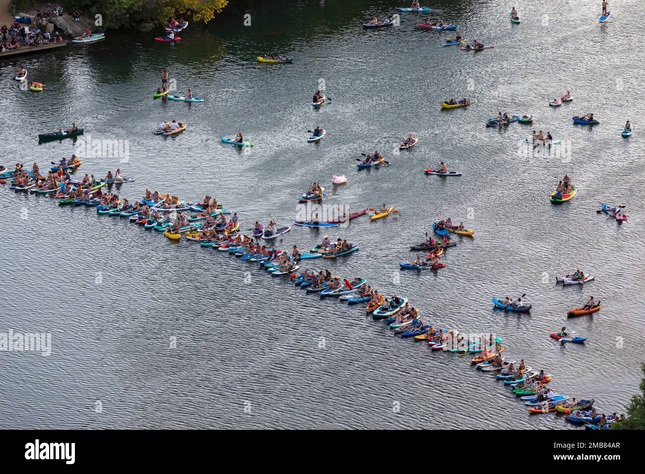 Kayaks gather on Lakebird Lake, Austin, TX to watch evening fireworks