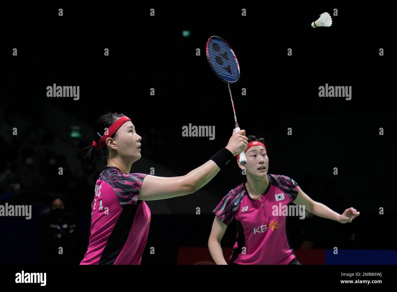 South Koreas Lee So-hee and Shin Seung-chan, left, compete against Japans Yuki Fukushima and Sayaka Hirota during their womens doubles semifinal match at Indonesia Open badminton tournament at Istora Gelora Bung Karno