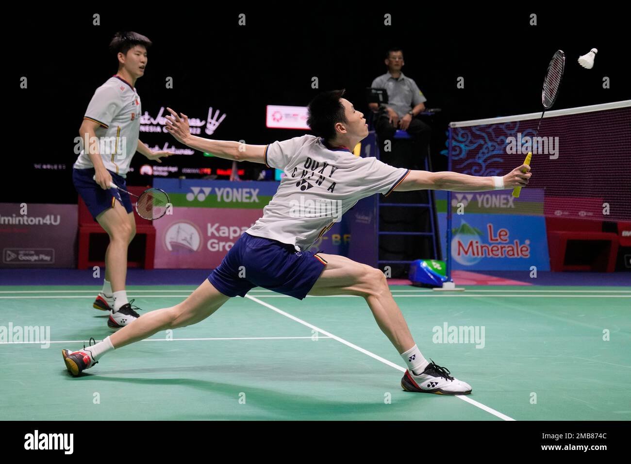 Chinas Liu Yu Chen, left, and Ou Xuan Yi compete against Malaysias Aaron Chia and Soh Wooi Yik during their mens doubles semifinal match at Indonesia Open badminton tournament at Istora Gelora