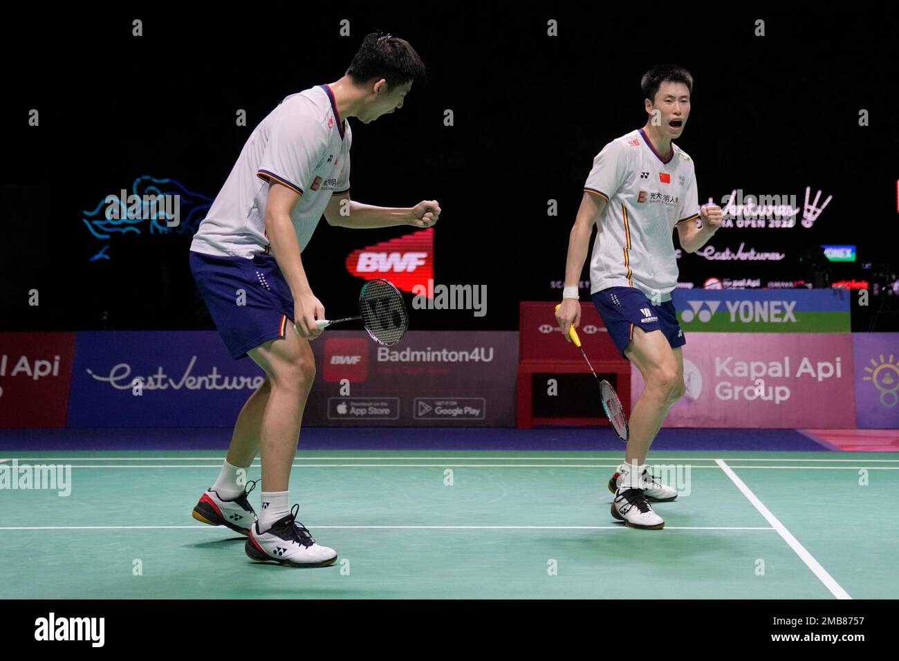 Chinas Liu Yu Chen, left, and Ou Xuan Yi celebrate after scoring a point against Malaysias Aaron Chia and Soh Wooi Yik during their mens doubles semifinal match at Indonesia Open badminton