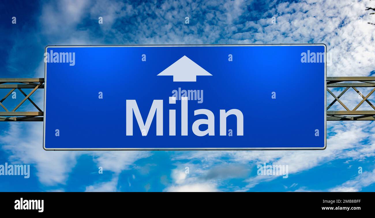 Road sign indicating direction to the city of Milan Stock Photo Alamy