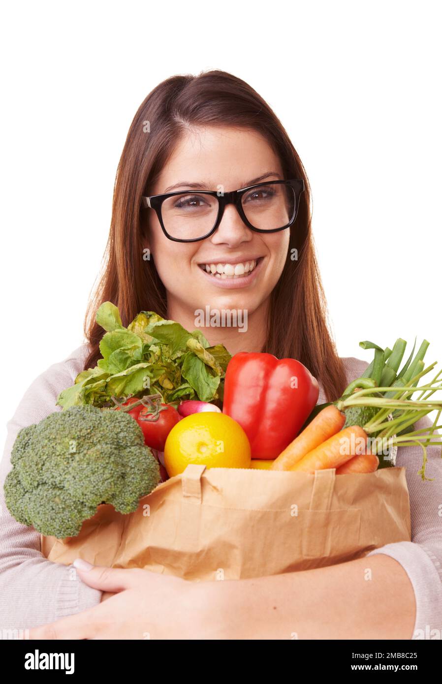 Shes conscious about eating healthy. Portrait of a beautiful young woman holding a bag of groceries. Stock Photo
