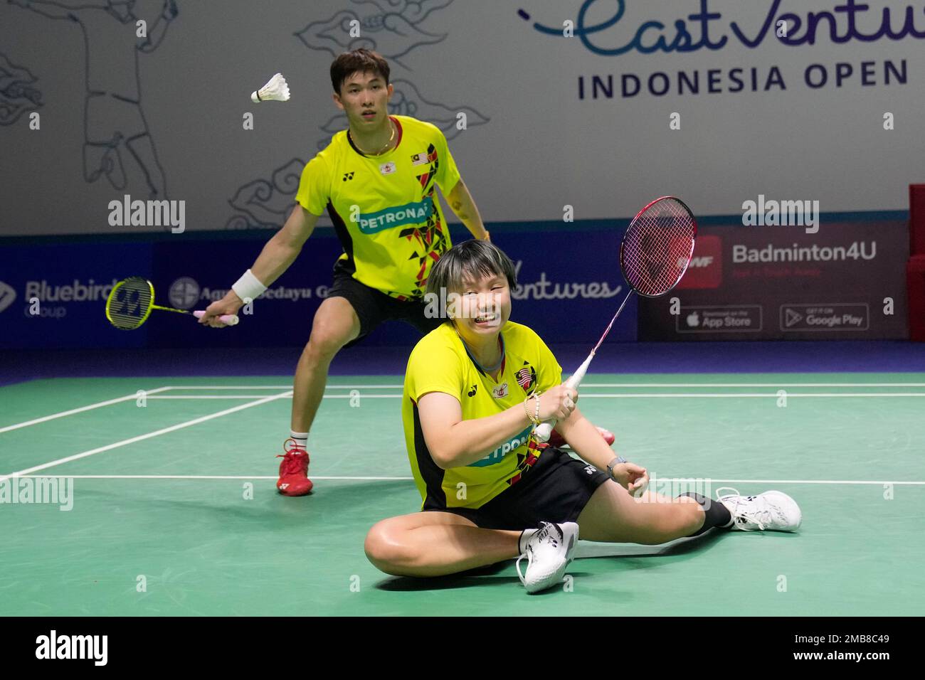 Malaysias Chen Tang Ji, rear, and Valeree Siow compete against Chinas Wang Yi Lyu and Huang Dong Ping during their mixed doubles quarterfinal match at Indonesia Open badminton tournament at Istora Gelora