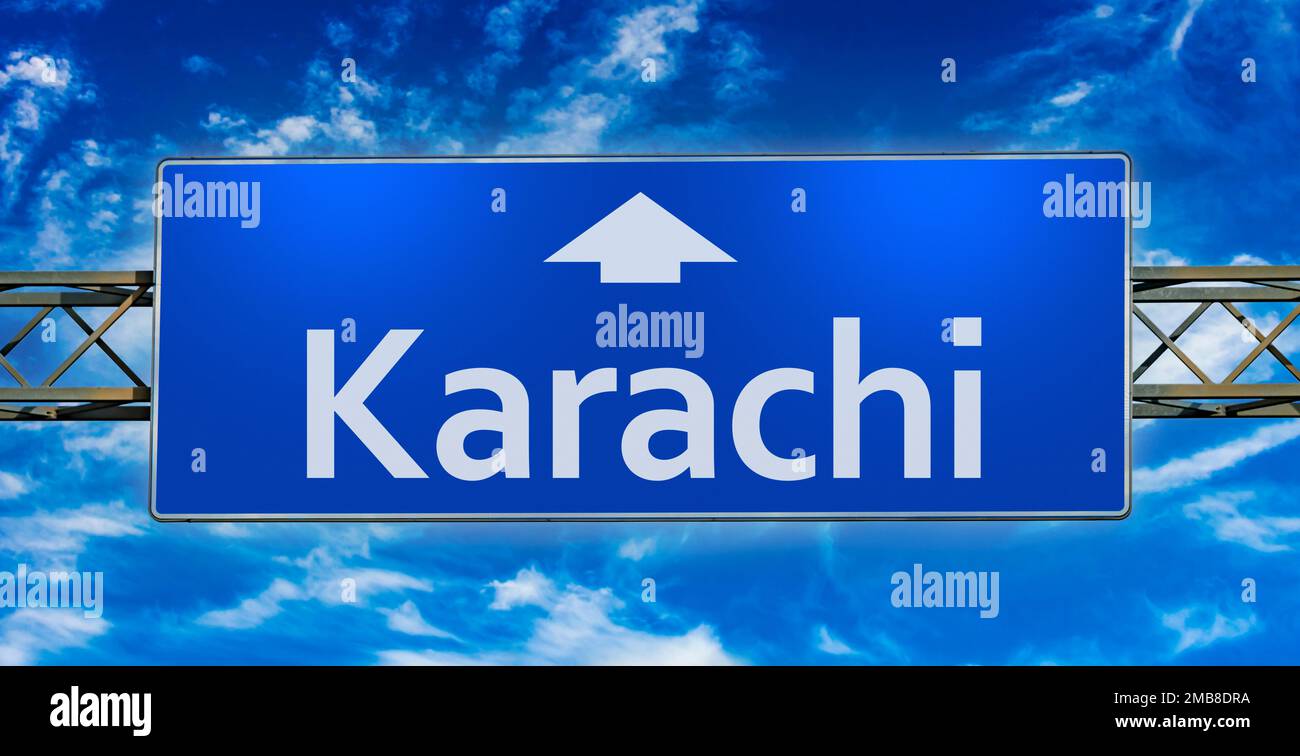 Road sign indicating direction to the city of Karachi Stock Photo Alamy