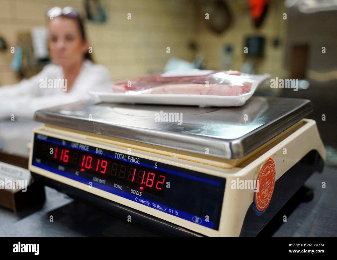 In this photo made on Thursday, June 16, 2022, Dawna Stenzel weighs