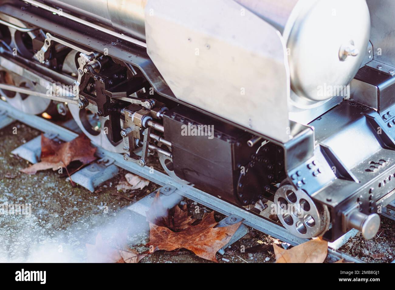 Old steam train wheel mechanism on a railway Stock Photo