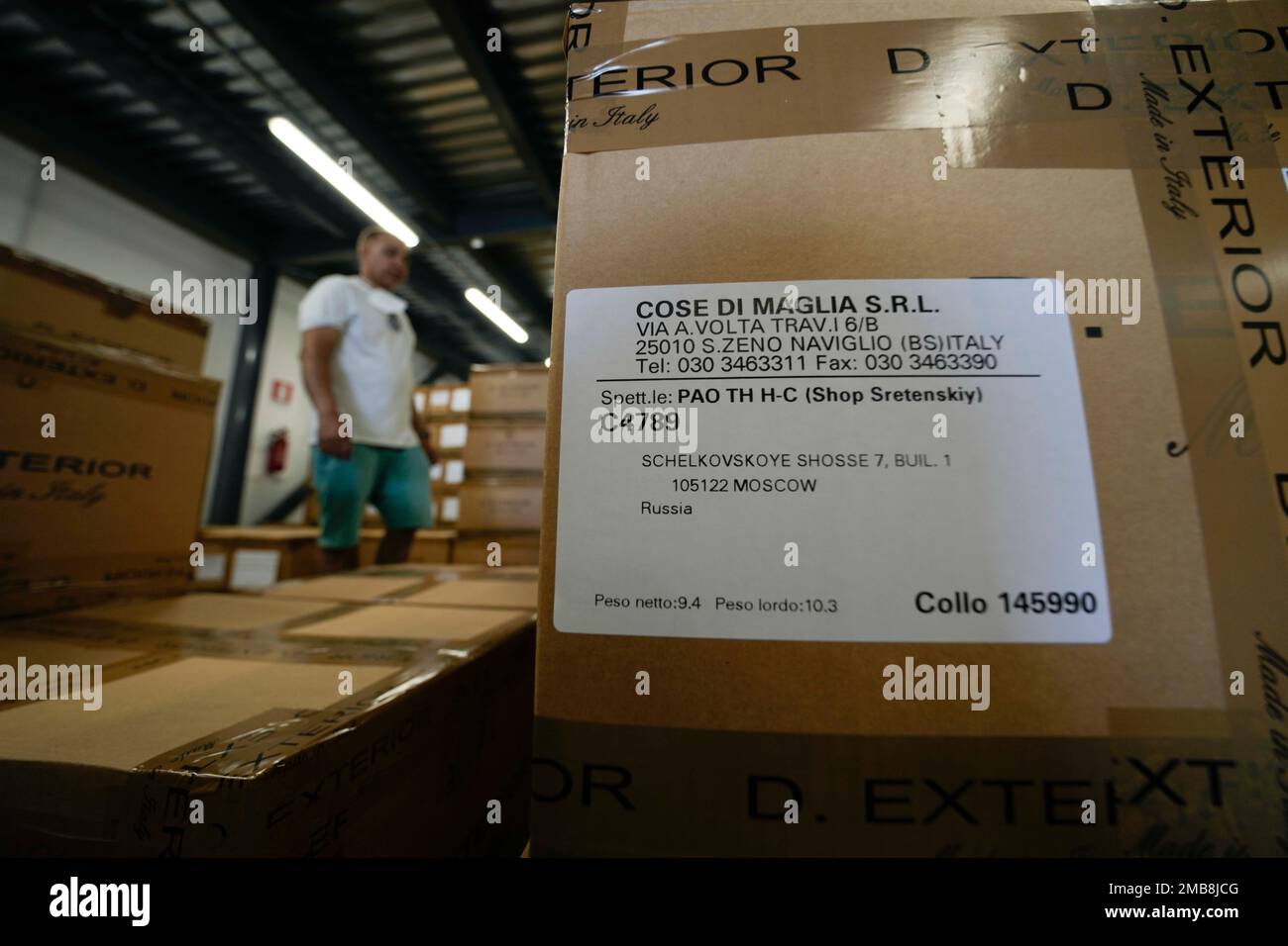 Cose di Maglia factory's storekeeper Malik goes through boxes of unsold  D.Exterior clothes intended for Moscow's stores, in Brescia, Italy,  Tuesday, June 14, 2022. Small Italian fashion producers are still allowed to