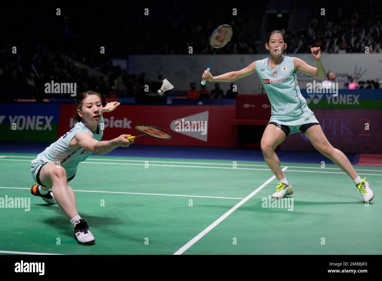 Japans Nami Matsuyama, right, and Chiharu Shida compete against Liu Xuan Xuan and Xia Yu Ting of China during their womens doubles second round match at Indonesia Open badminton tournament at Istora
