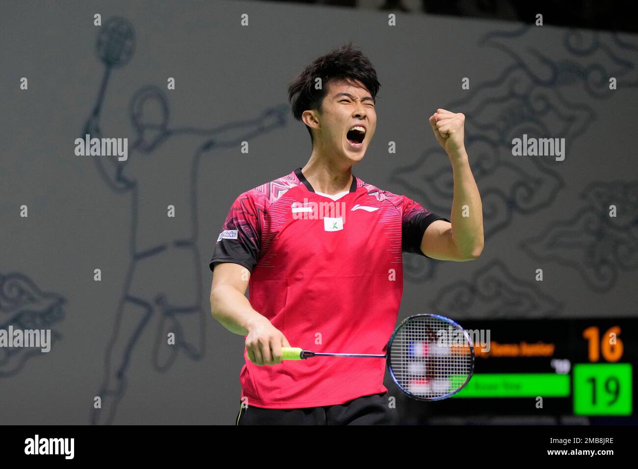 Singapores Loh Kean Yew reacts after scoring a point against France Toma Junior Popov during their mens singles second round match at Indonesia Open badminton tournament at Istora Gelora Bung Karno Stadium