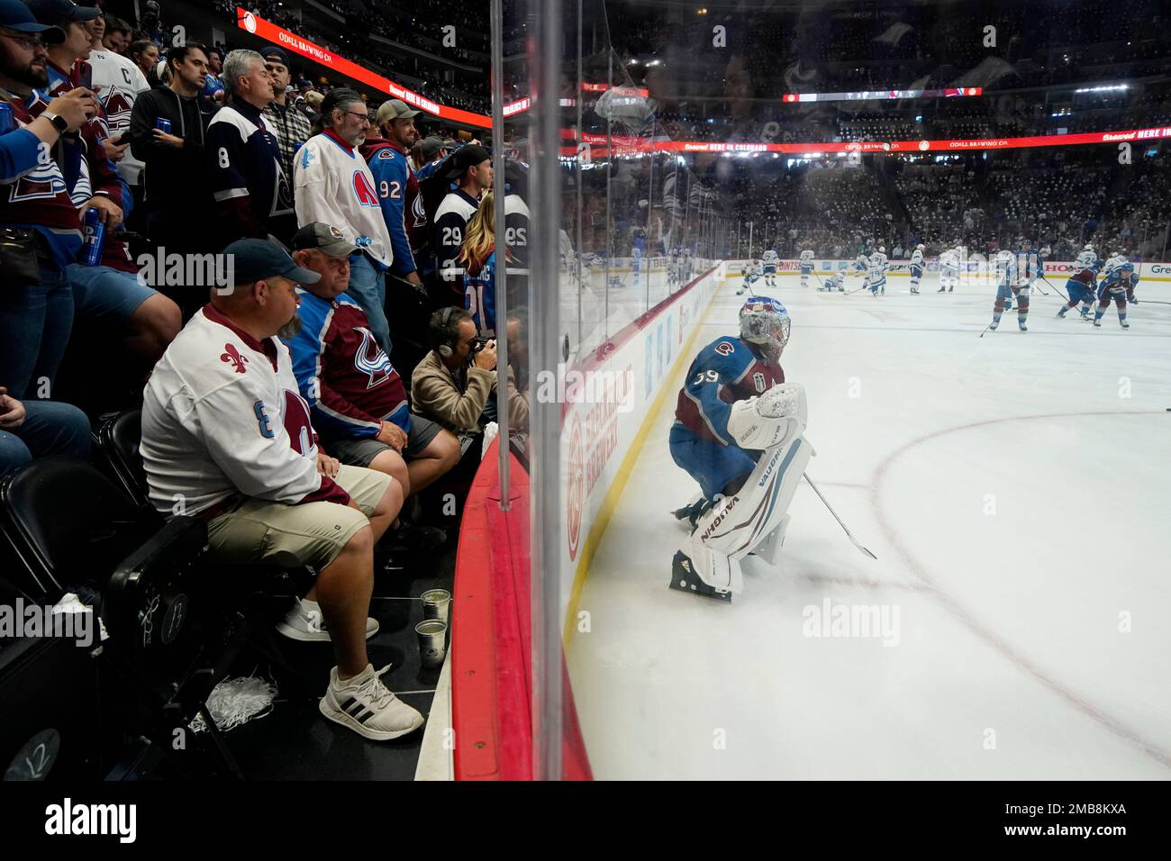 Fans watch Colorado Avalanche goaltender Pavel Francouz warm up before Game 1 of the NHL hockey Stanley Cup Final between the Colorado Avalanche and the Tampa Bay Lightning Wednesday, June 15, 2022,