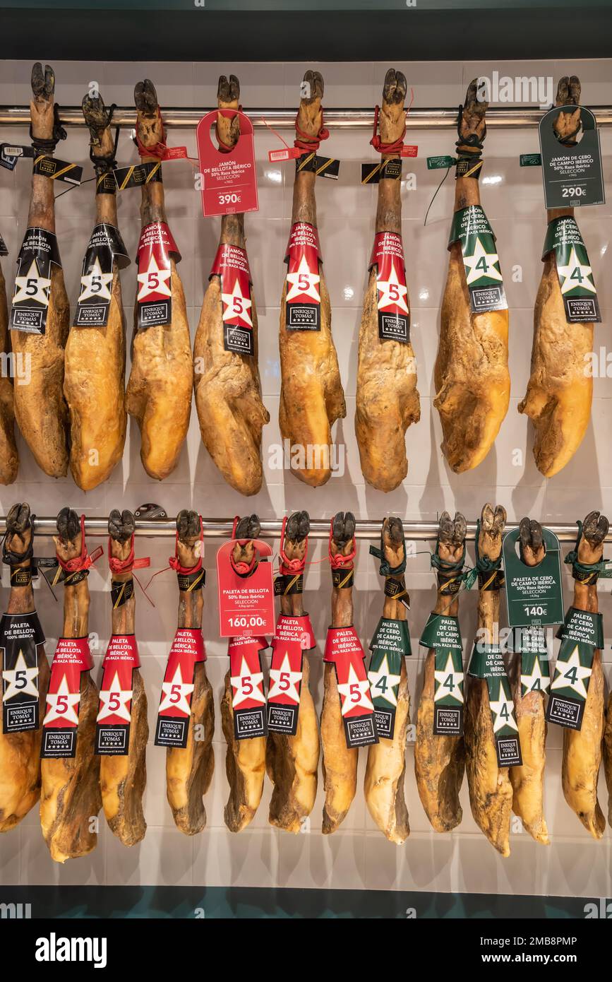 Valencia, Spain – January 19, 2023. Enrique Tomas paleta ham and ham shoulders on display in Valencia, Spain. Stock Photo