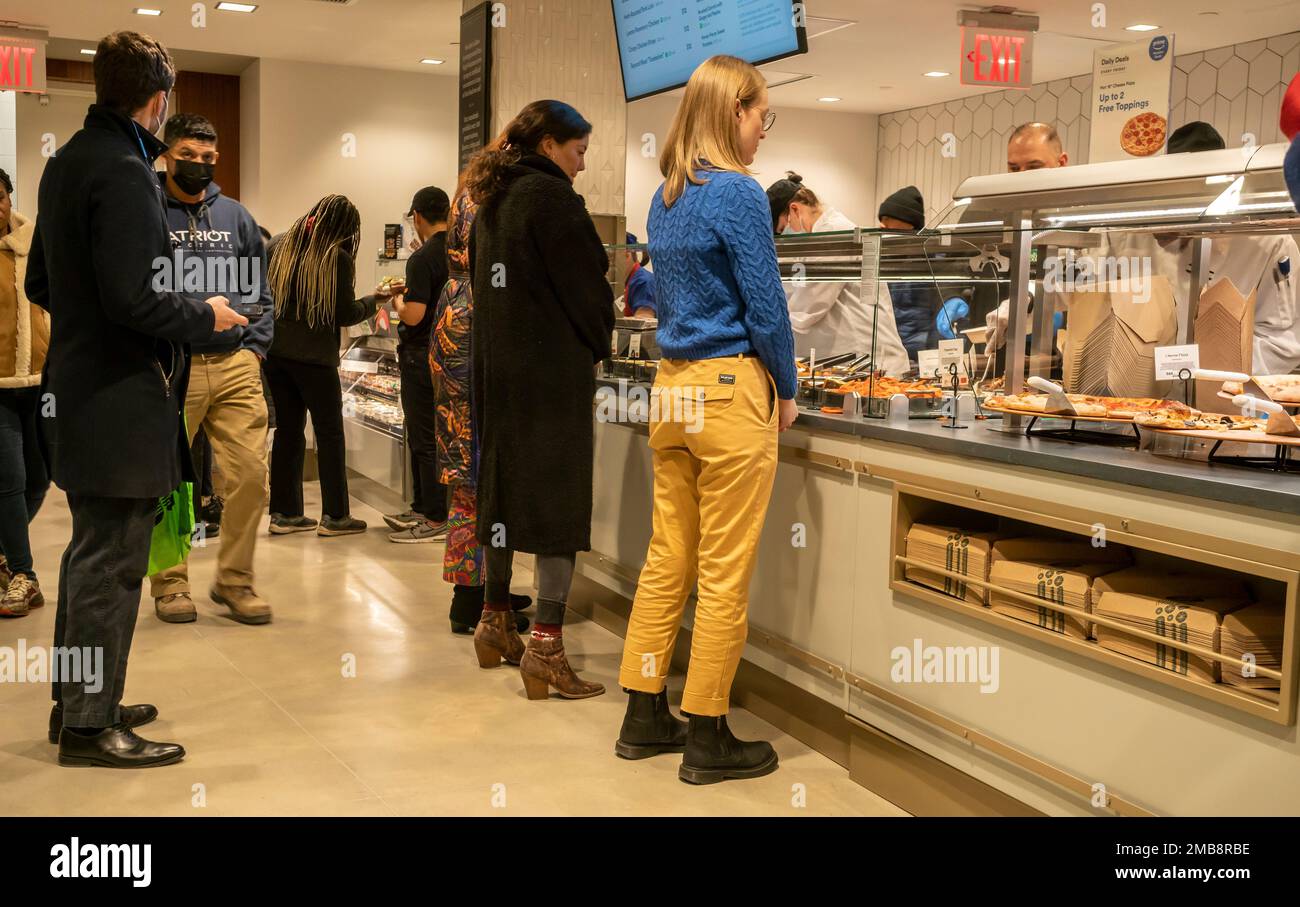 Office workers take out lunch at the grand opening of Whole Foods Market Wall Street supermarket in New York on Wednesday, January 11, 2023. Analysts predict that tomorrows inflation data will confirm that inflation is cooling. (© Richard B. Levine) Stock Photo