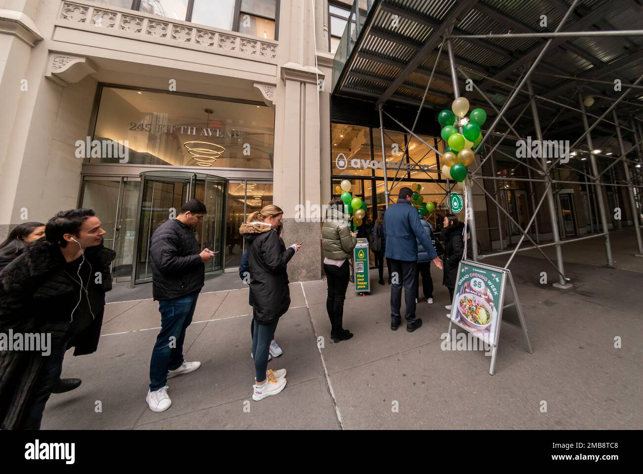 People line up at the opening of a branch of the Avocaderia restaurant chain in the NoMad neighborhood of New York on Tuesday, January 17, 2023. The fast casual avocado themed restaurant has four branches, all in New York, and has expanded with capital received via Shark Tank.(© Richard B. Levine) Stock Photo