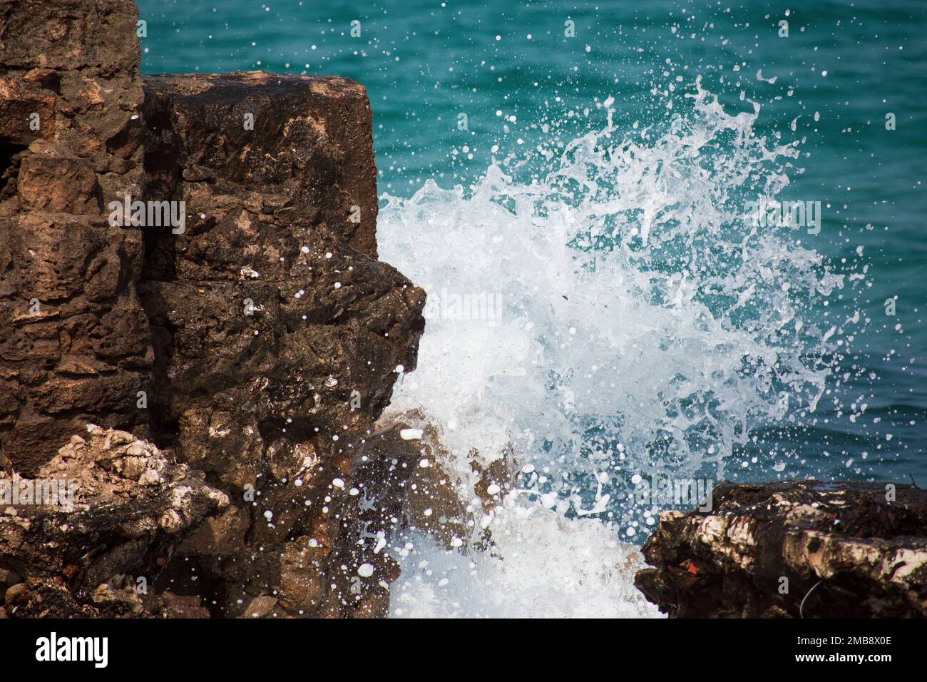 Sea slamming on the rocks Stock Photo