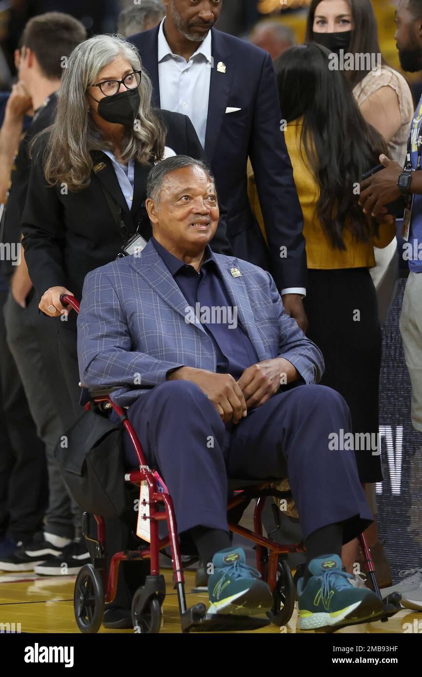 The Rev. Jesse Jackson is pushed in a wheelchair at Chase Center before  Game 5 of basketball's NBA Finals between the Golden State Warriors and the  Boston Celtics in San Francisco, Monday,