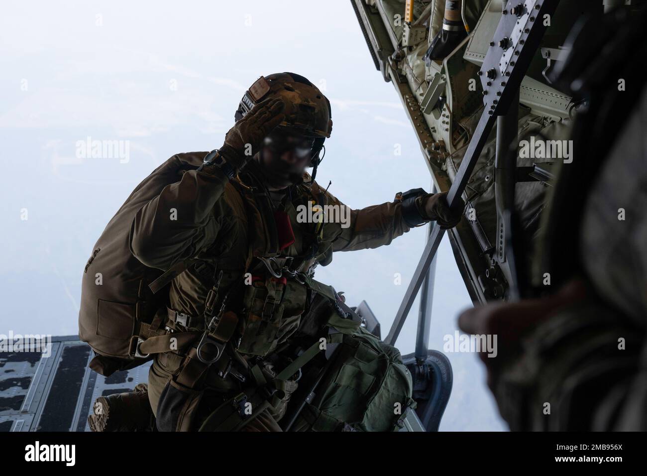 A U.S Air Force Special Tactics Operator assigned to the 23 Special Tactics  Squadron prepares for a military free fall jump over Donnelly Training  Area, Alaska, during Red Flag 22-2 June 13