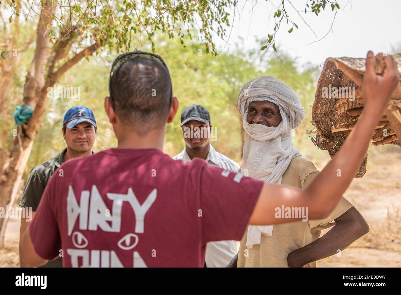 U.S. Soldiers from the 404th and 443rd Civil Affairs Battalions (CAB), assigned to the 409th Air Expeditionary Group, meet with the village chief in Azel Kheloway, Niger, June 13, 2022. During the meeting, they discussed the need for a medical clinic in the village, and the 404th CAB introduced the new civil affairs team from the 443rd CAB and bid farewell to village leaders and citizens who they’ve built relationships with as a part of the enduring relationship between the U.S. and the citizens of Niger. Stock Photo