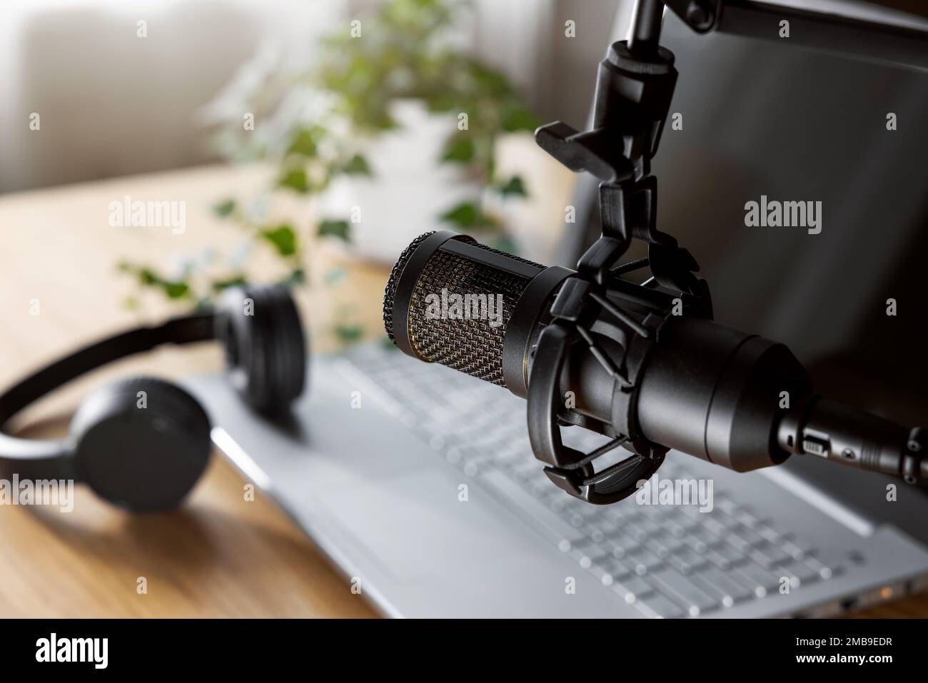 home studio for podcast recording, radio broadcasting. workplace of content creator. microphone closeup Stock Photo