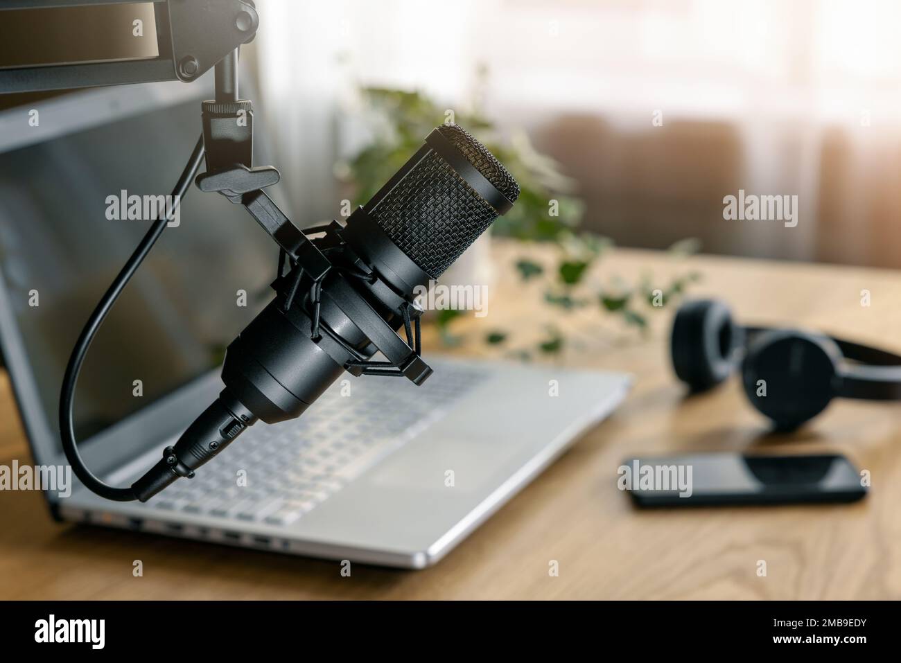 workplace of content creator. home studio for podcasting, online streaming, radio broadcasting. microphone closeup Stock Photo