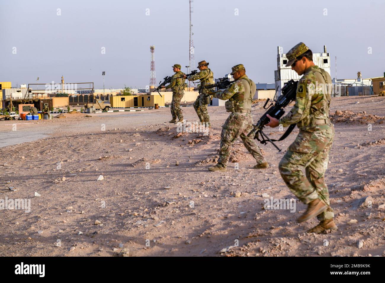 U.S. Soldiers assigned to Task Force Hurricane from the 1st Battalion, 124th Infantry Regiment, move in line during a platoon immersion in Al-Kharj, Kingdom of Saudi Arabia, June 13, 2022. The immersion was a training event meant to build interoperability between the U.S Army and Royal Saudi Land Force at the platoon level while enhancing both U.S. and partner nation skillsets. Stock Photo