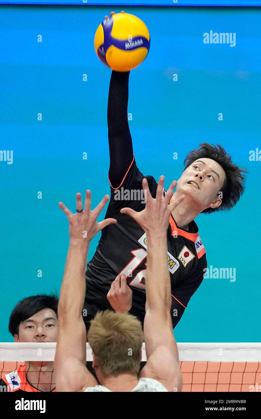 Japans Ran Takahashi spikes the ball against the U.S.s Kyle Ensing during their mens Nations League volleyball match in Brasilia, Brazil, Friday, June 10, 2022