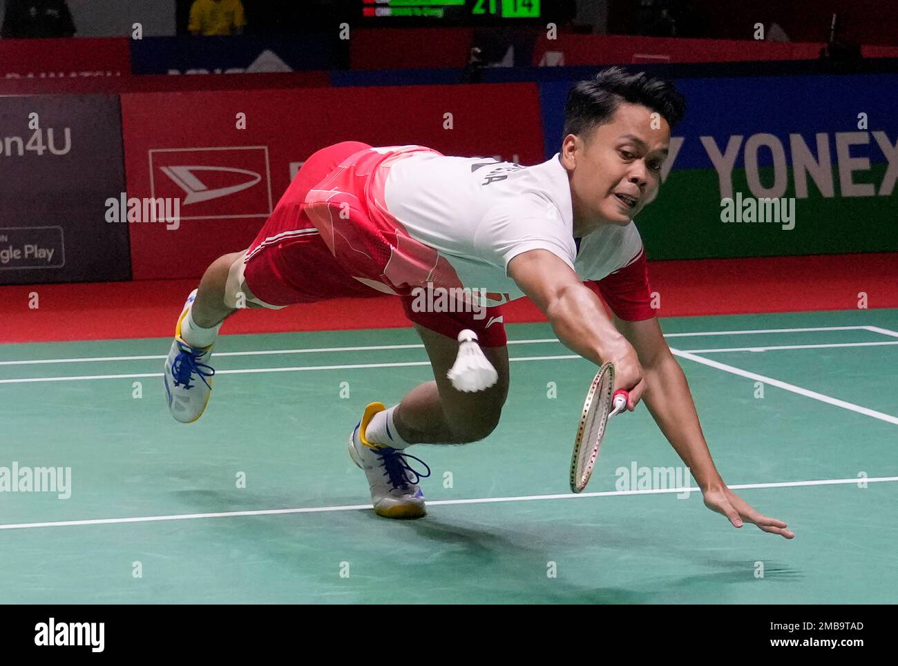 Anthony Sinisuka Ginting of Indonesia returns a shot to Lee Zii Jia of Malaysia during the quarterfinal round of the mens single match in the Indonesia Masters badminton tournament in Jakarta, Indonesia,
