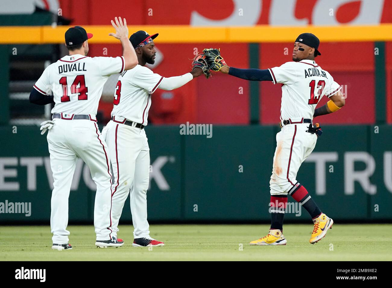 Atlanta Braves outfielders from left; Adam Duvall (14), Marcell Ozuna (2) and Ronald Acuna Jr