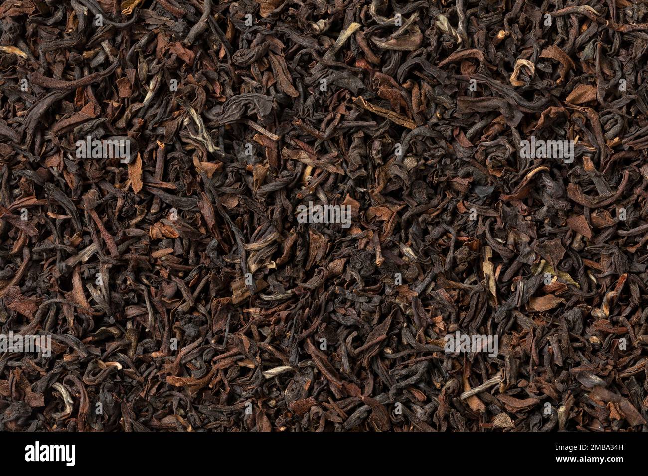 Indian Tukvar darjeeling dried tea leaves close up full frame as background Stock Photo