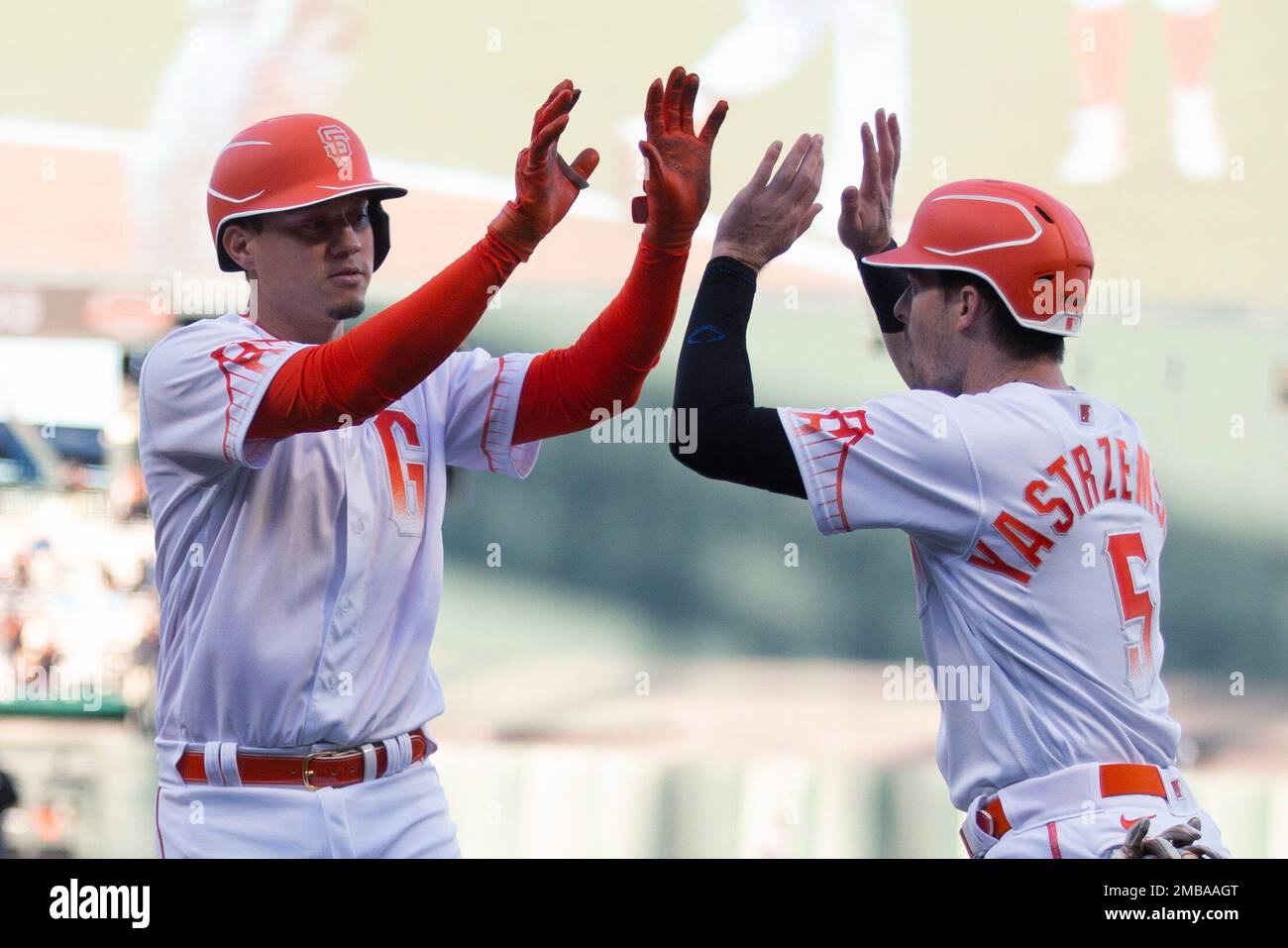San Francisco Giants' Wilmer Flores and Mike Yastrzemski (5) celebrate