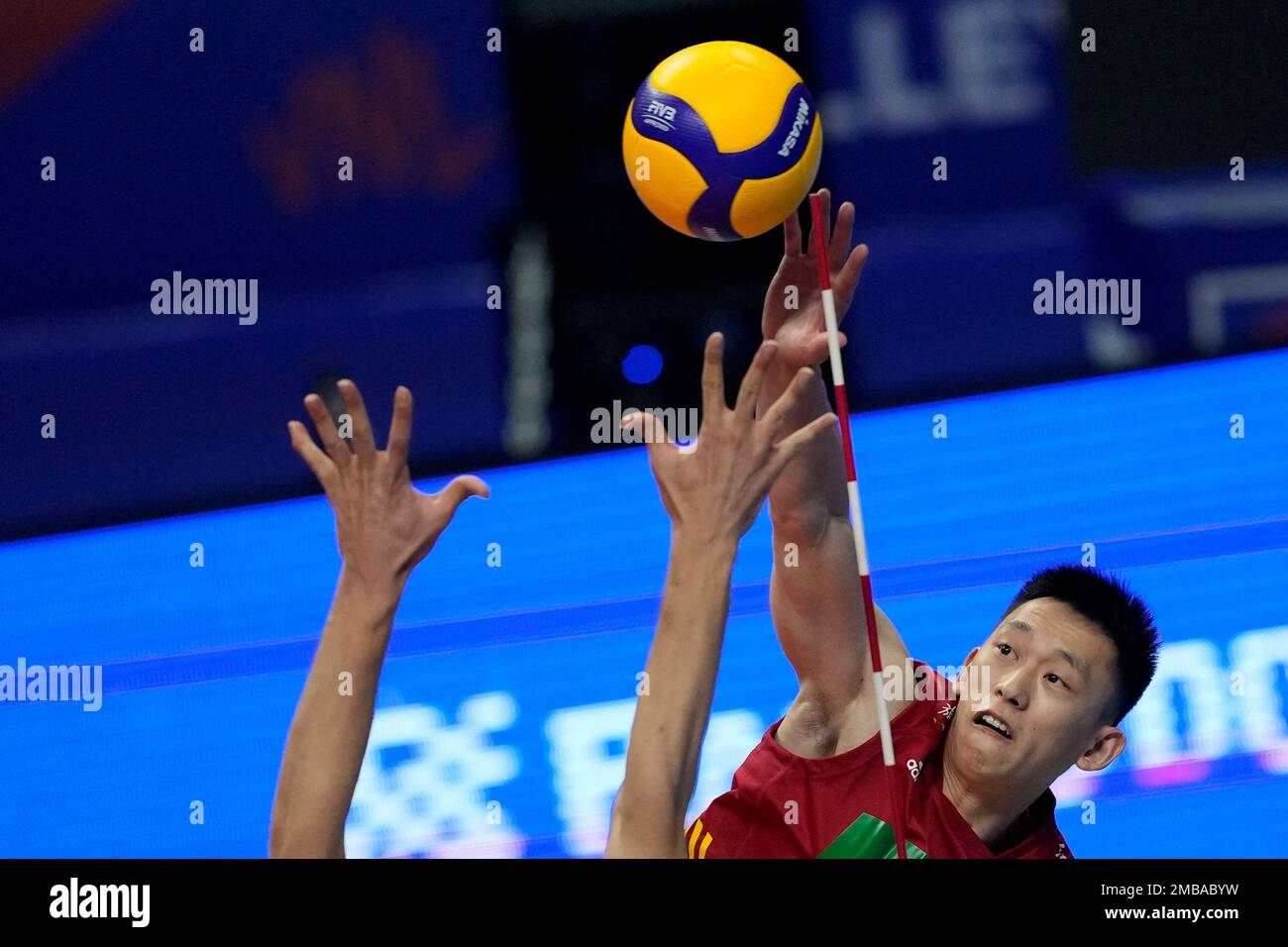 Chinas Zhang spikes the ball during mens Nations League volleyball match against Iran, in Brasilia, Brazil, Tuesday, June 7, 2022