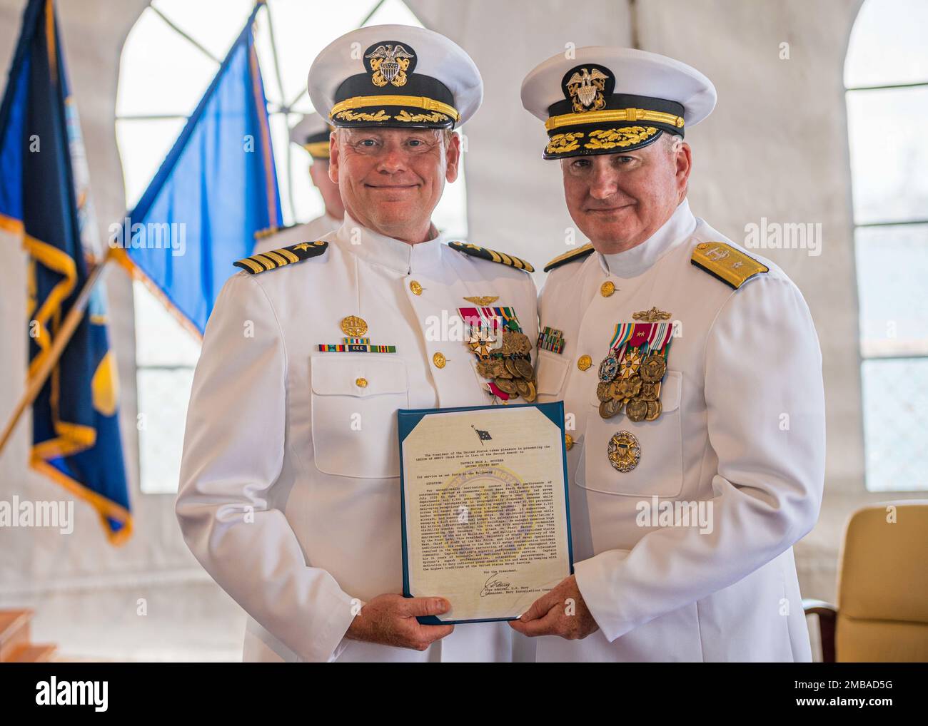 220614-N-KN989-1006 JOINT BASE PEARL HARBOR-HICKAM, Hawaii (June 14, 2022) Rear Adm. Timothy Kott, Commander, Navy Region Hawaii, presents Capt. Erik Spitzer, Commander, Joint Base Pearl Harbor-Hickam, the Legion of Merit Award during a change of command ceremony aboard USS Missouri (BB-63). Spitzer was relieved by Capt. Mark Sohaney during the official change of command ceremony June 14, 2022. Joint Base Pearl Harbor-Hickam delivers the best service in base operating support to supported and tenant commands to enable operational mission success while simultaneously providing the highest quali Stock Photo