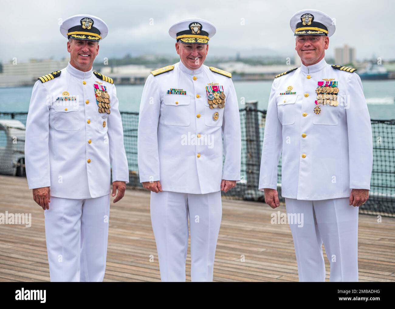 220614-N-KN989-1012 JOINT BASE PEARL HARBOR-HICKAM, Hawaii (June 14, 2022) Rear Adm. Timothy Kott, Commander, Navy Region Hawaii (center), Capt. Mark Sohaney, Commander, Joint Base Pearl Harbor-Hickam (left) and Capt. Erik Spitzer (right) pose for a picture following a change of command ceremony aboard USS Missouri (BB-63). Sohaney relieved Capt. Erik Spitzer during the official change of command ceremony June 14, 2022. Joint Base Pearl Harbor-Hickam delivers the best service in base operating support to supported and tenant commands to enable operational mission success while simultaneously p Stock Photo