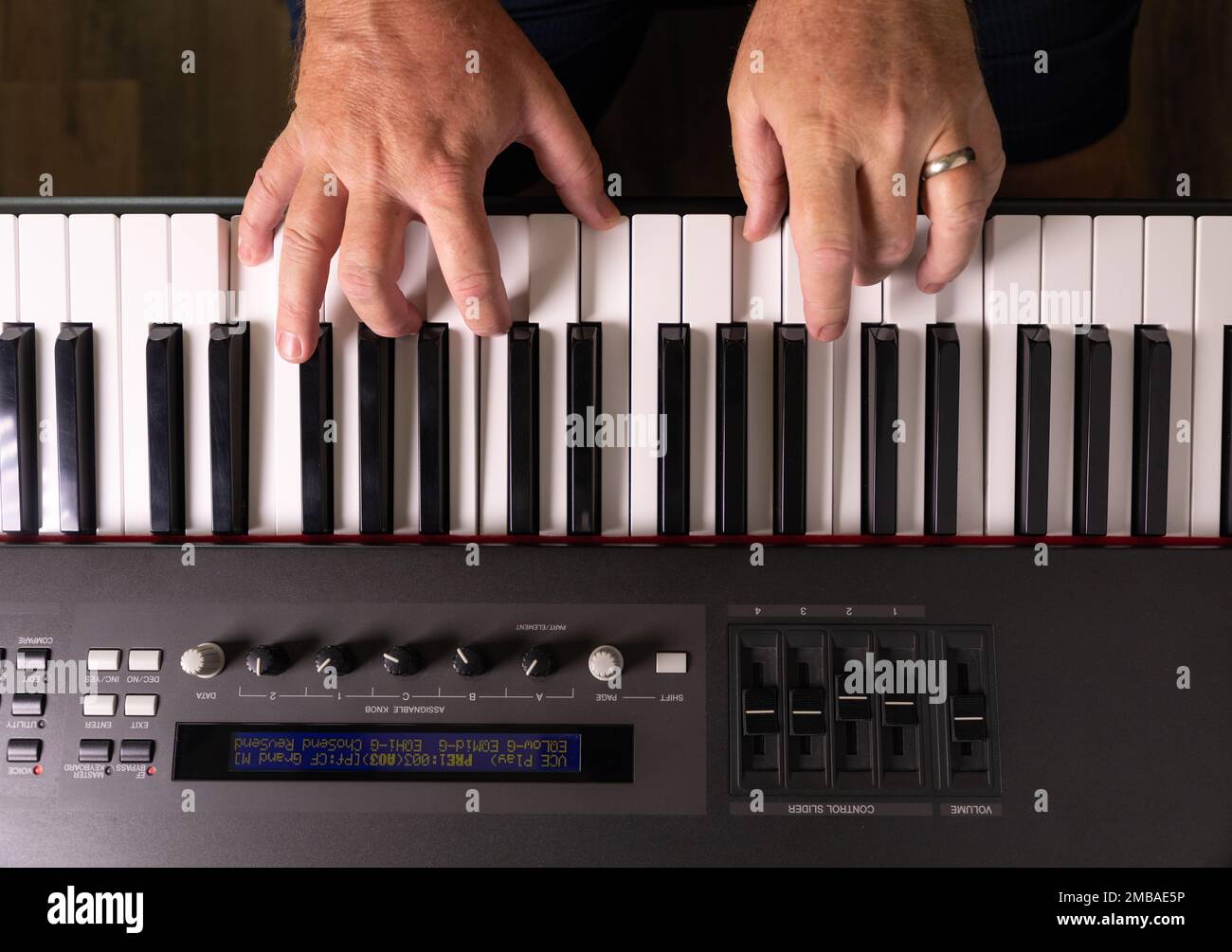 Male Hands Practicing on the Electronic Piano Keyboard Stock Photo Alamy