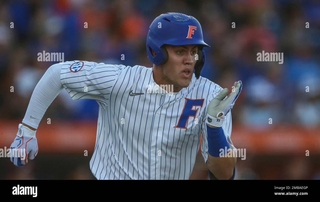 Florida outfielder Ty Evans (2) runs to first base during an NCAA