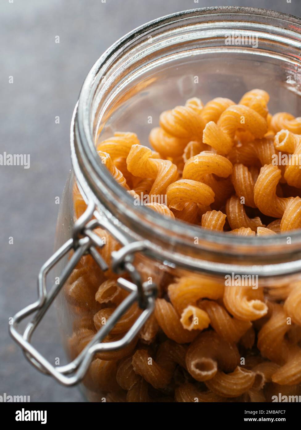 Jar with organic lupine pasta, wholemeal pasta with lupine flour. Stock Photo