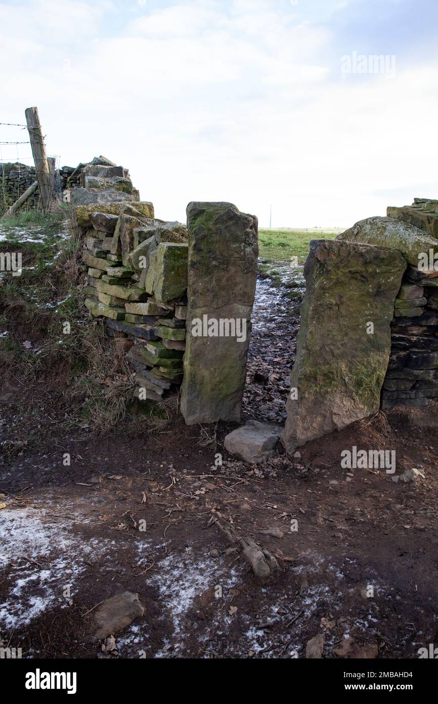 Leg stile in a dry stone wall to permit access by people but not livestock Stock Photo