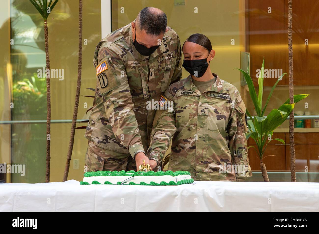 Lt. Col.Alex Duran and Sgt. Janice Medina, the oldest and youngest soldier attached to the Defense POW/MIA Accounting Agency cut the cake in a ceremony for the 247th Army birthday at the DPAA Facility on Joint Base Pearl Harbor-Hickam, Hawaii, June 14, 2022. The ceremony was held to commemorate the Army birthday honoring 247 years of rich history and defense of the nation. DPAA's mission is to achieve the fullest possible accounting for missing and unaccounted for U.S. personnel to their families and our nation. Stock Photo