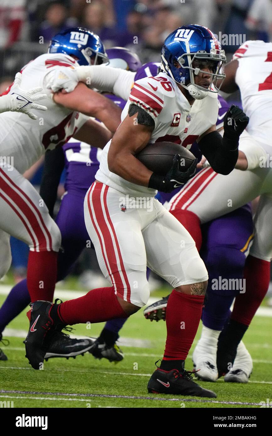 New York Giants running back Saquon Barkley (26) runs up field during the  first half of an NFL wild card playoff football game against the Minnesota  Vikings, Sunday, Jan. 15, 2023, in