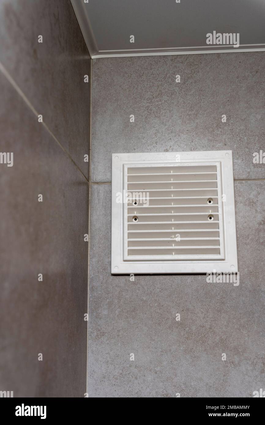plastic white ventilation grille in the bathroom. Ventilation device