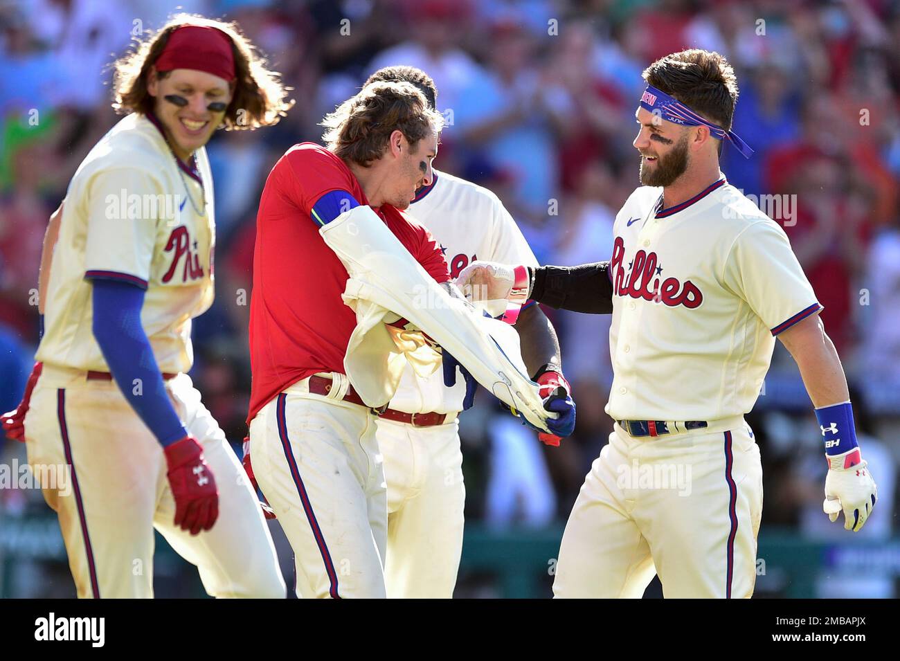 Philadelphia Phillies' Bryson Stott, center, celebrates his walkoff home  run with Bryce Harper, right, Alec Bohm, left, during the ninth inning of a  baseball game against the Los Angeles Angels, Sunday, June
