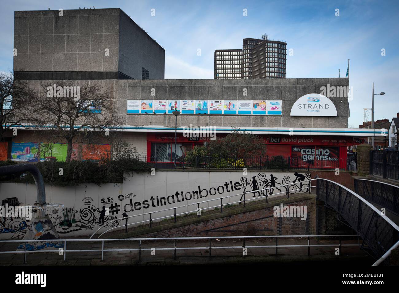 A mural on a wall on the side of the Strand shopping centre next to the Liverpool-Leeds Canal in the town of Bootle, Sefton, which adjoins the city of Liverpool. It was announced in 2015 that the HMRC was set to close its office at Triad House in Bootle, which it was feared would result in job losses in the town. The facility was eventually wound-up in late 2021. Image to illustrate feature on the UK Government’s so-called levelling up agenda. Stock Photo