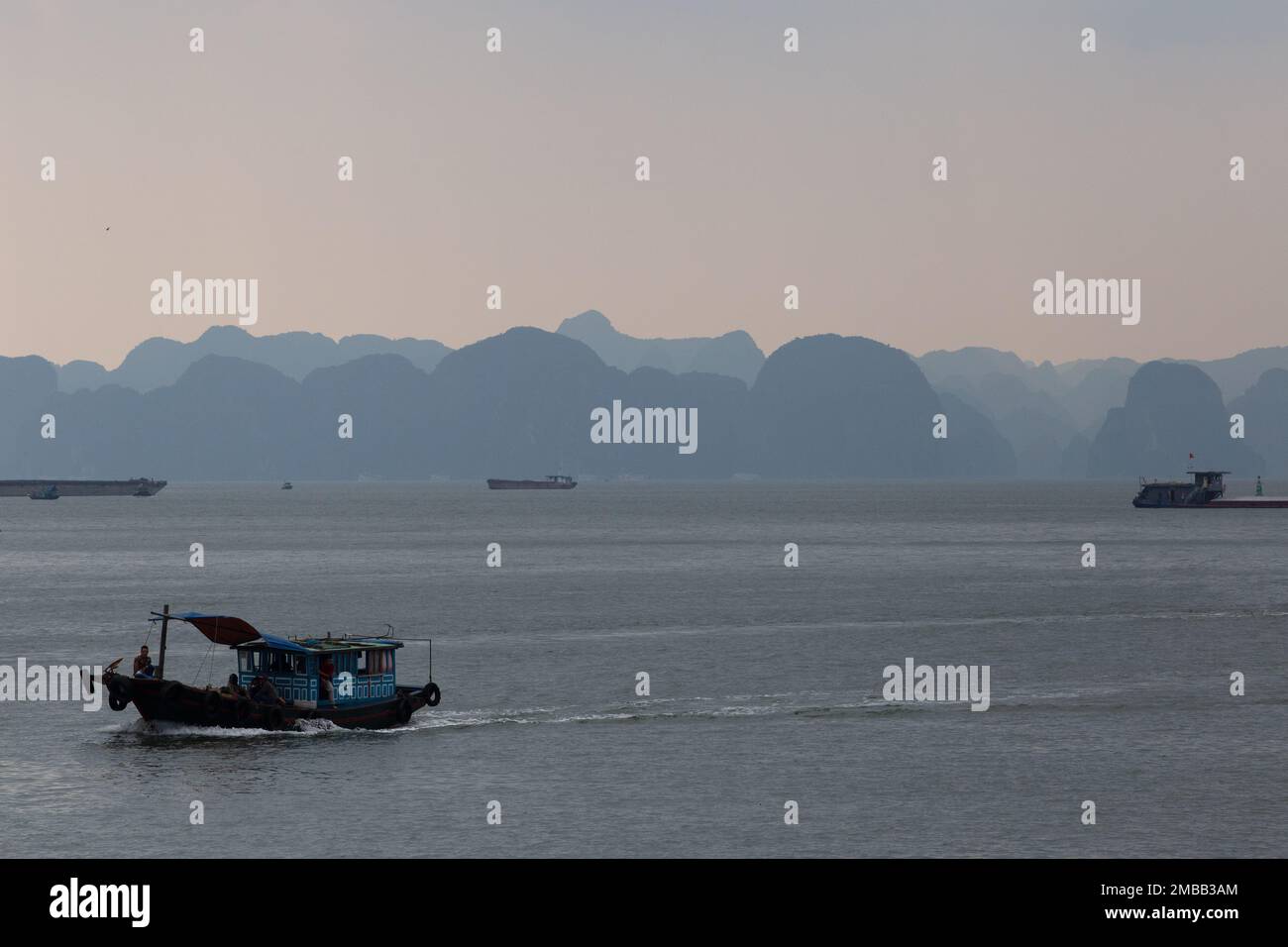 Ha Long Bay ( Halong bay ) View Over Landscape - boats float through the impressive landscape . Ha Long Bay , Vietnam Stock Photo