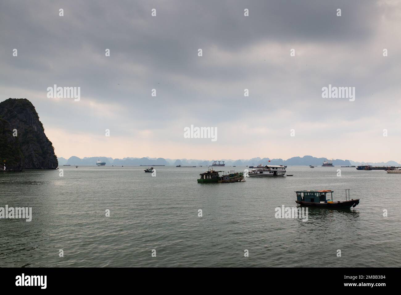 Ha Long Bay ( Halong bay ) View Over Landscape - boats float through the impressive landscape . Ha Long Bay , Vietnam Stock Photo