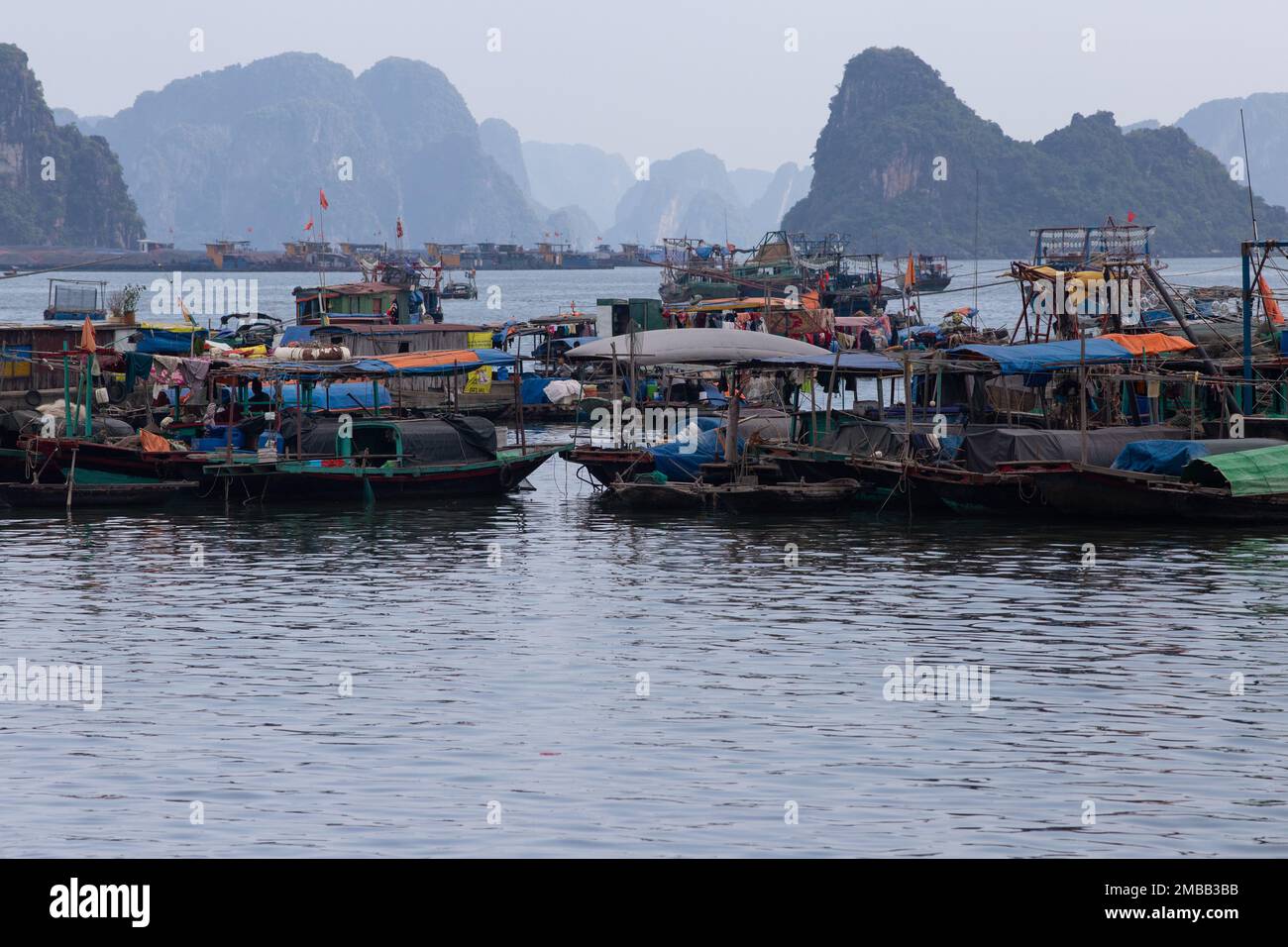 Ha Long Bay ( Halong bay ) View Over Landscape - boats float through the impressive landscape . Ha Long Bay , Vietnam Stock Photo
