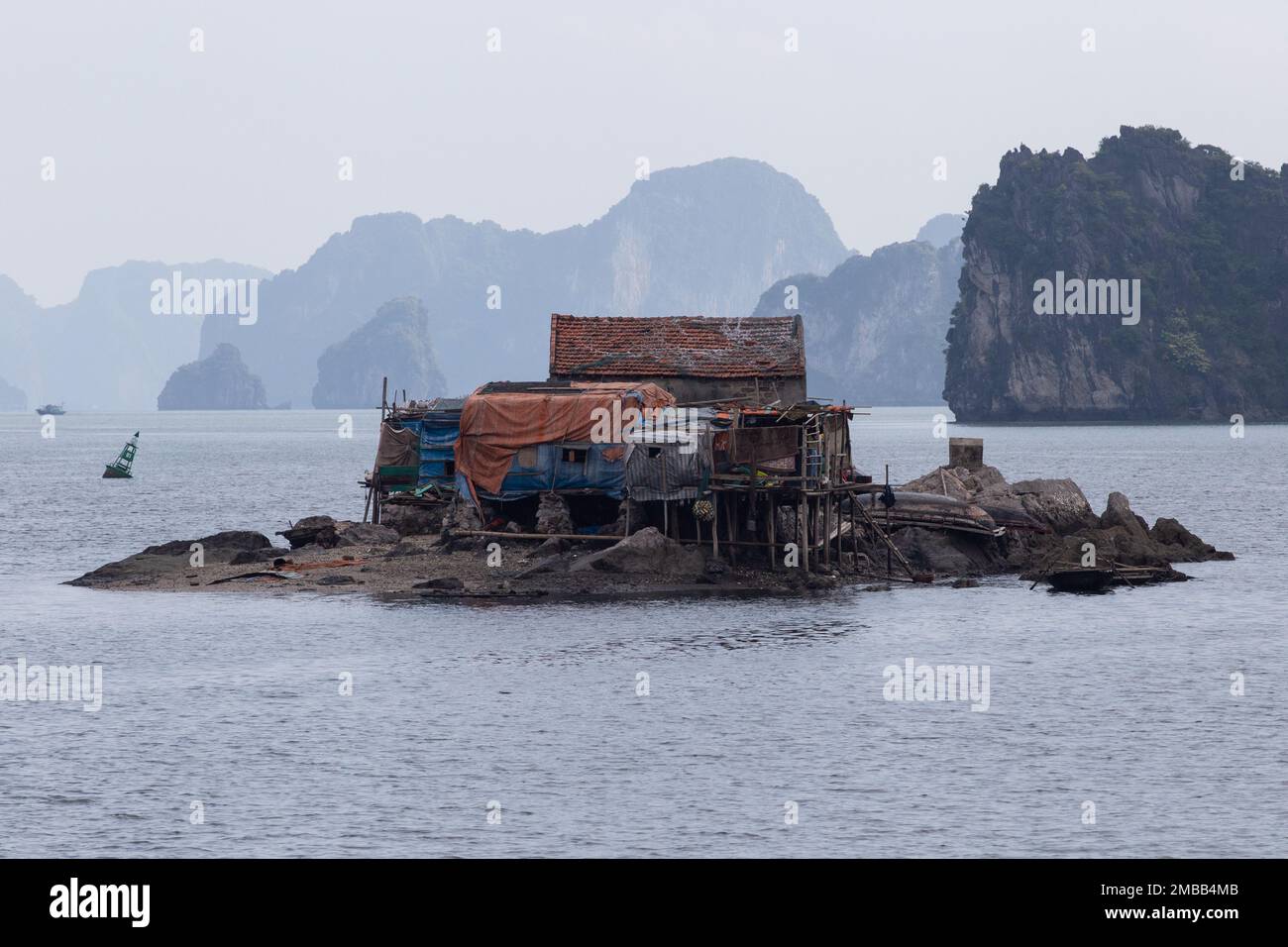 Ha Long Bay ( Halong bay ) View Over Landscape - A shanty built upon a small island -  Ha Long Bay , Vietnam Stock Photo