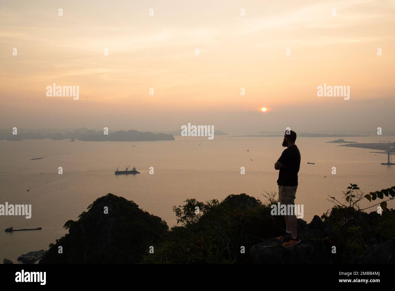 Ha Long Bay ( Halong bay ) View Over Landscape - boats float through the impressive landscape . Ha Long Bay , Vietnam Stock Photo